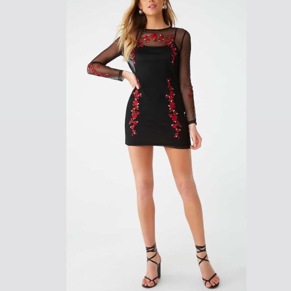 Black mini dress with rose detailing.